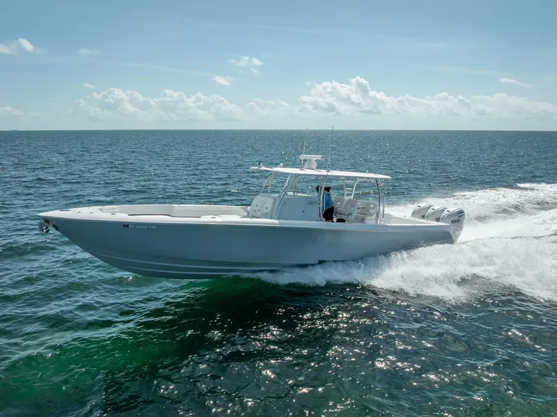 Slide: The Image of 2025 Contender 44 ST boat cruising on open ocean waters. - 33