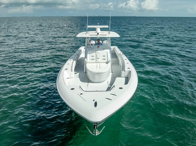 Slide: The Image of 2025 Contender 44 ST boat on open ocean, clear skies, aerial view. - 4