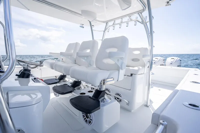 Slide: The Image of Luxury seating on 2025 Contender 44 ST boat, ocean backdrop, modern design. - 43