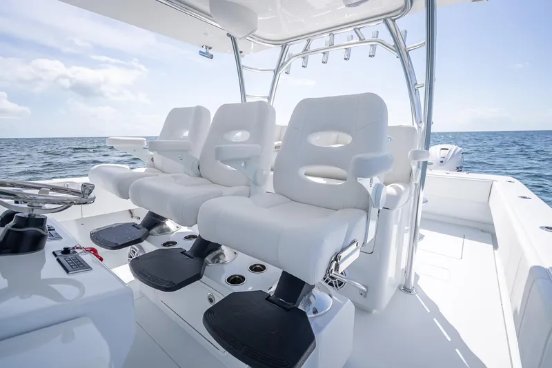 Slide: The Image of 2025 Contender 44 ST boat interior with white seating, ocean view. - 47