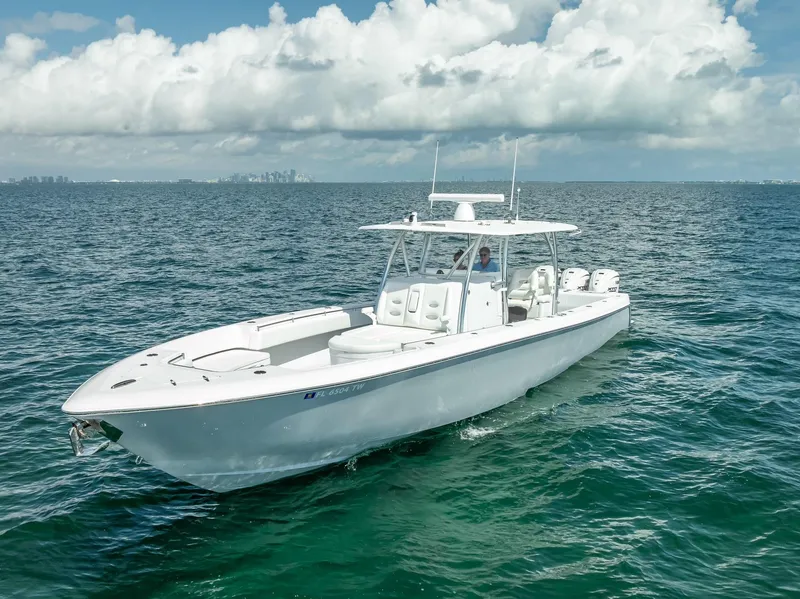 Slide: The Image of 2025 Contender 44 ST boat on open ocean under cloudy sky. - 5