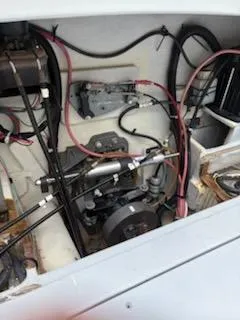 Slide: The Image of Engine compartment of 2013 ENVI 25 Offshore Center Console boat, showing wiring and mechanical components. - 13