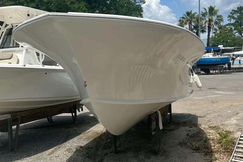 Slide: The Image of 2013 ENVI 25 Offshore Center Console boat on display outdoors. - 5