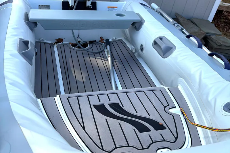 Slide: The Image of 2021 Highfield Classic 290 inflatable boat interior with gray flooring and seating. - 3