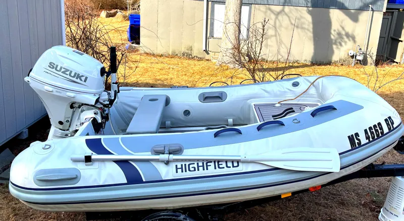Slide: The Image of 2021 Highfield Classic 290 inflatable boat with Suzuki outboard motor on trailer. - 4