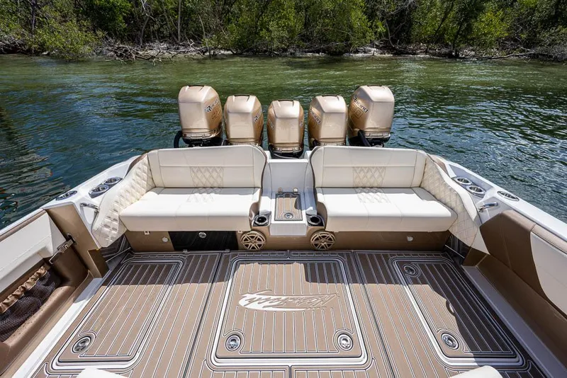 Slide: The Image of 2019 Nor-Tech 450 Sport Center Console boat with luxurious seating and powerful engines. - 15