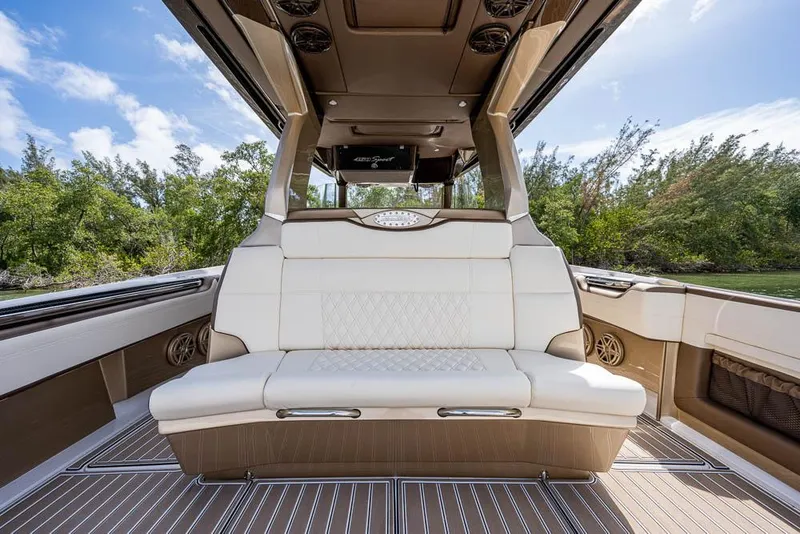 Slide: The Image of 2019 Nor-Tech 450 Sport Center Console interior with luxurious seating and elegant design. - 19