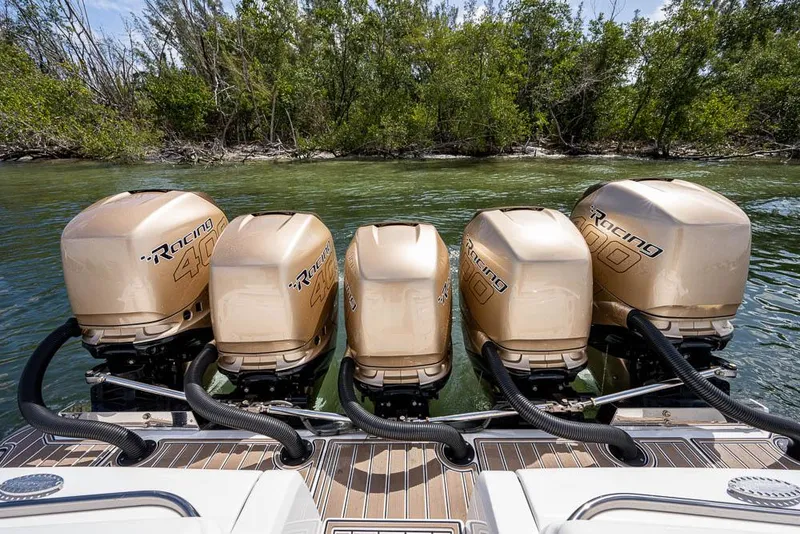 Slide: The Image of 2019 Nor-Tech 450 Sport Center Console with five powerful outboard engines. - 27