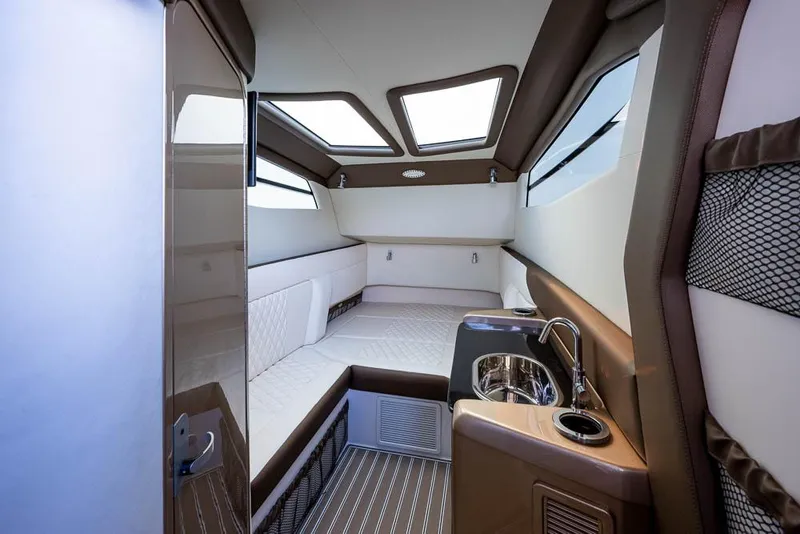 Slide: The Image of Luxurious interior of 2019 Nor-Tech 450 Sport Center Console boat cabin. - 30