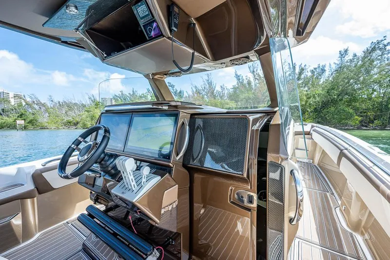 Slide: The Image of 2019 Nor-Tech 450 Sport Center Console interior with modern dashboard and steering wheel. - 8
