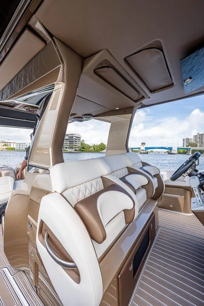 Slide: The Image of 2019 Nor-Tech 450 Sport Center Console interior with luxurious seating and modern design. - 9