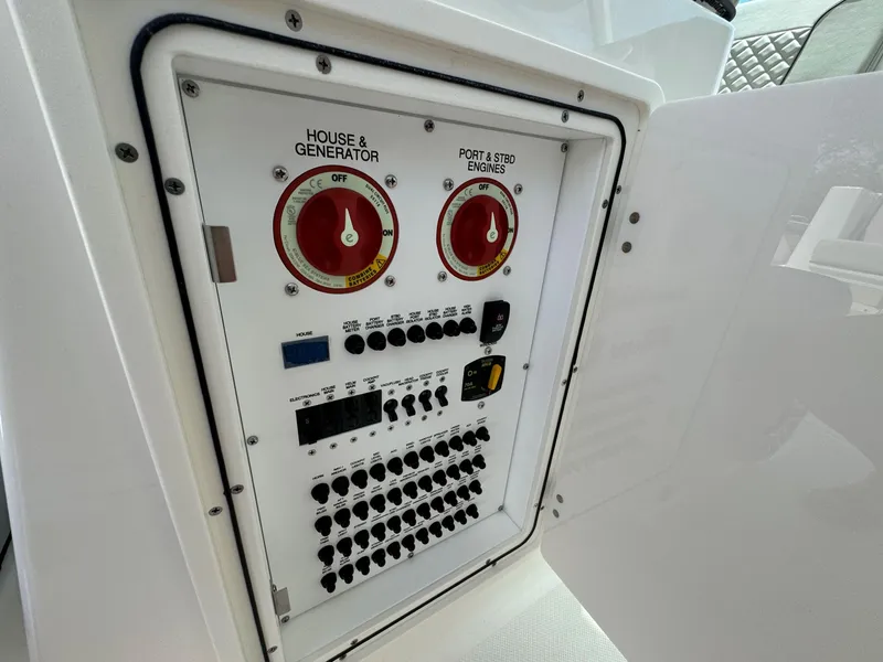 Slide: The Image of 2025 Pursuit DC 326 boat interior with storage compartments and sleek design. - 11