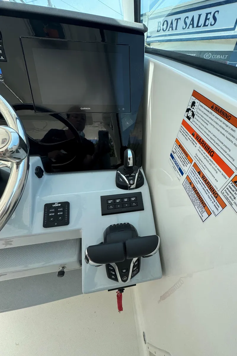 Slide: The Image of Electrical control panel on 2025 Pursuit DC 326 boat, featuring switches and gauges. - 16