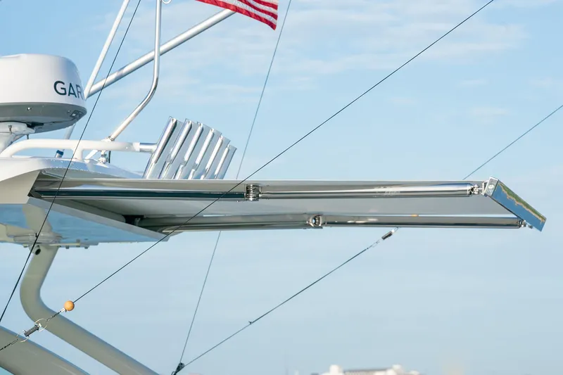 Slide: The Image of Pursuit DC 326 boat with radar and fishing rod holders, 2025 model. - 28