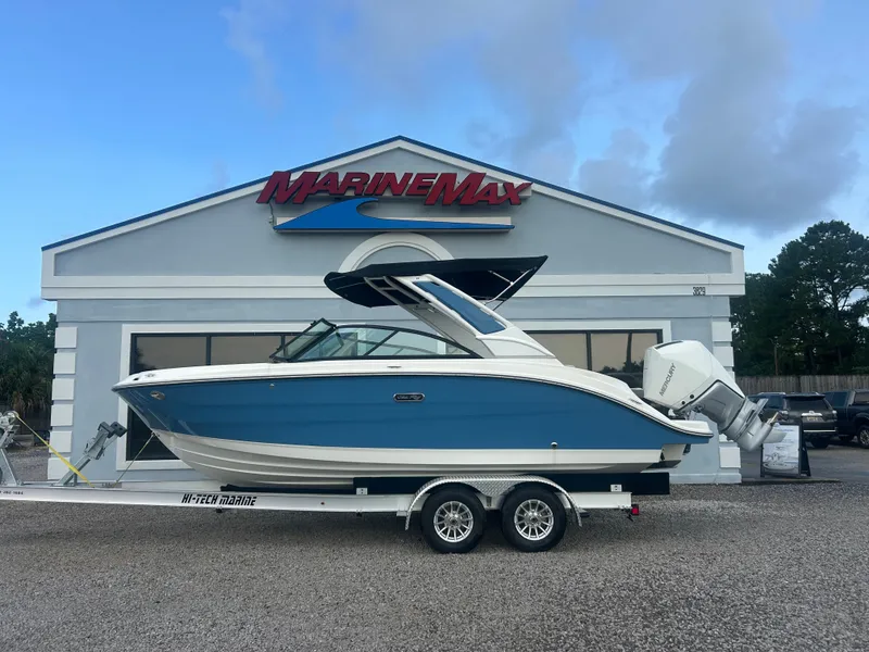 Slide: The Image of A 2026 Sea Ray SDX 230 Outboard sits on a trailer in front of a MarineMax building. - 1
