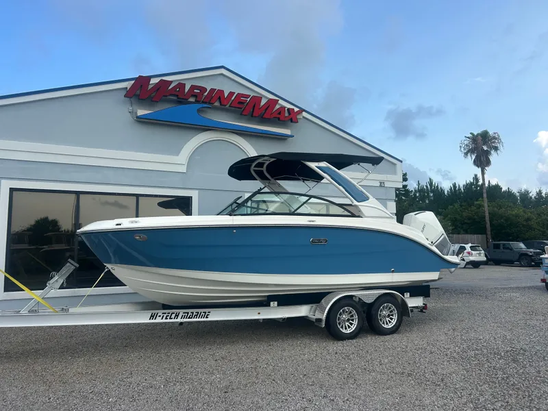 Slide: The Image of A 2026 Sea Ray SDX 230 Outboard on a trailer in front of a MarineMax building. - 3