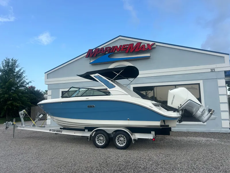 Slide: The Image of 2026 Sea Ray SDX 230 Outboard on a trailer in front of a MarineMax building. - 4