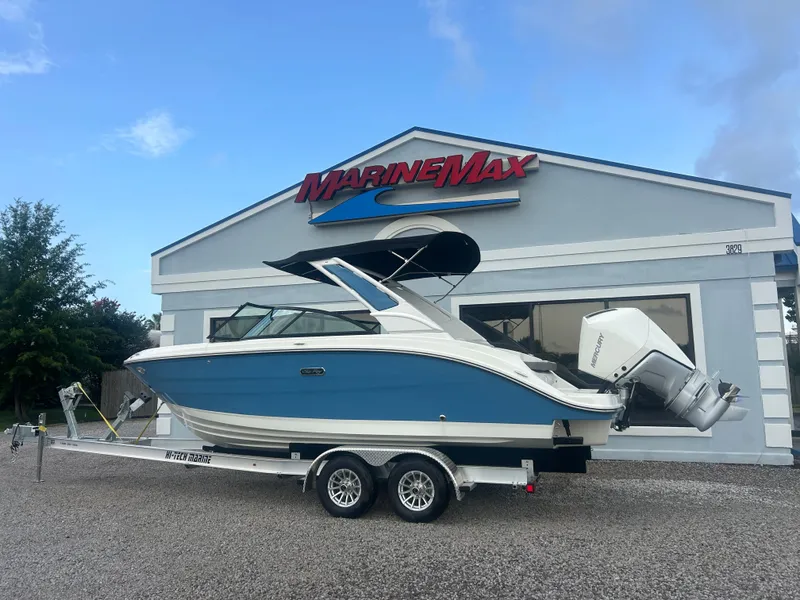 Slide: The Image of A 2026 Sea Ray SDX 230 Outboard on a trailer in front of a MarineMax building. - 5