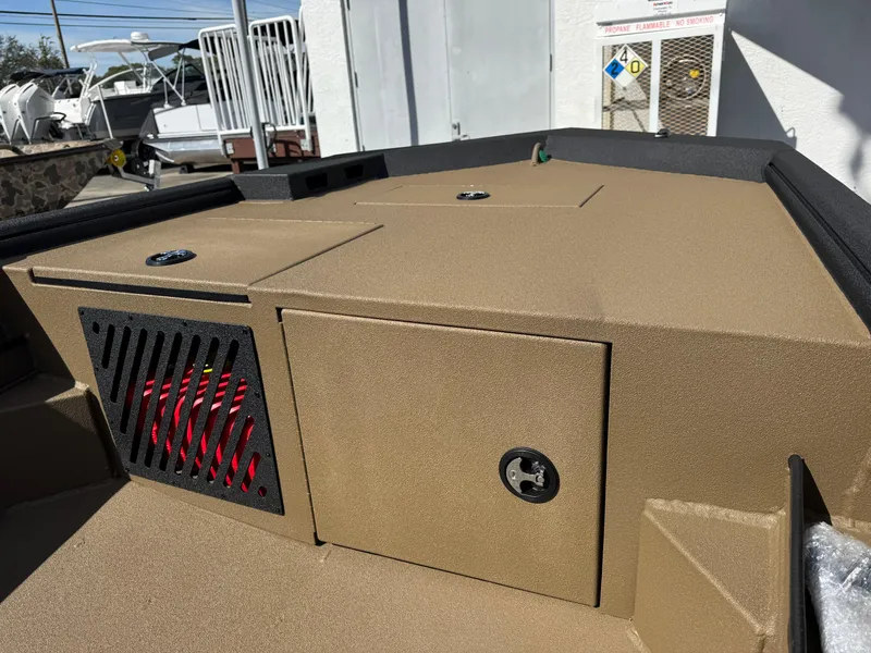 Slide: The Image of 2025 Excel Eclipse boat deck with storage compartments and ventilation. - 10