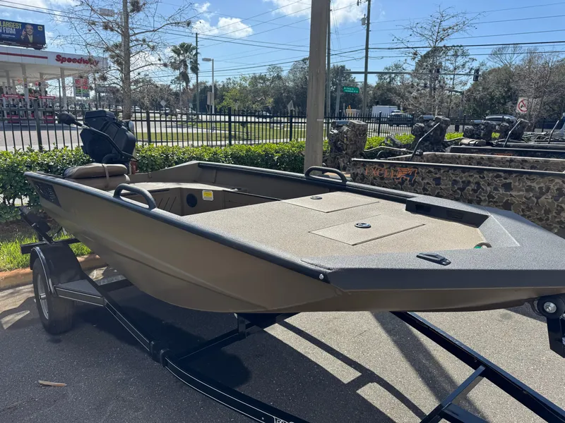 Slide: The Image of 2025 Excel Eclipse boat on trailer, parked outdoors near a gas station. - 11