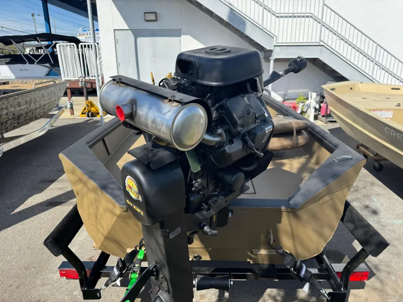 Slide: The Image of Outboard motor on Excel Eclipse 2025 boat, parked outdoors near stairs. - 5