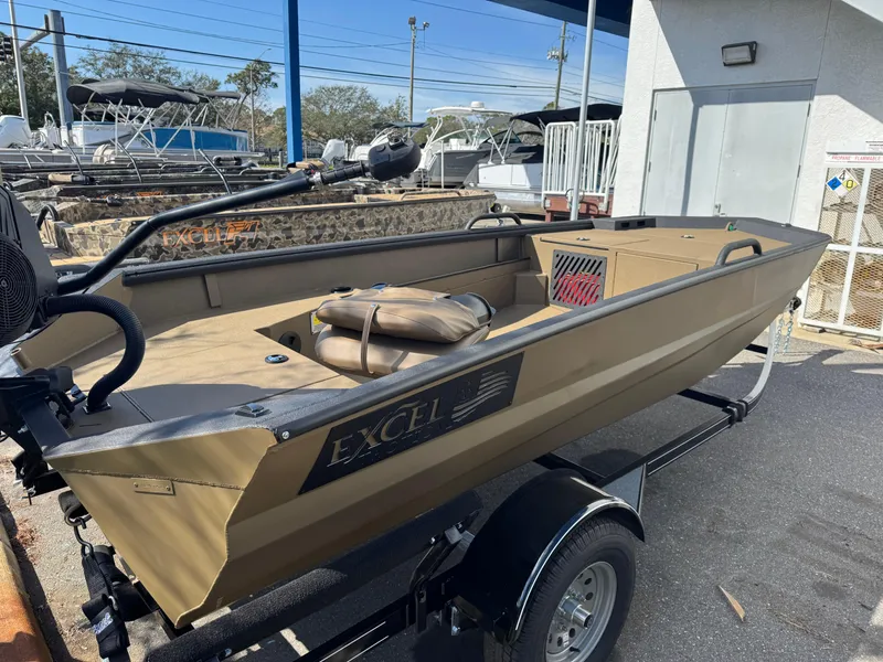 Slide: The Image of 2025 Excel Eclipse boat on trailer, parked outdoors, showcasing sleek design and spacious interior. - 7