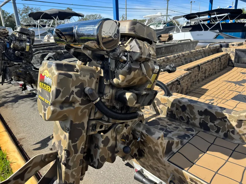 Slide: The Image of 2025 Excel 1860 F4 Shallow Water boat with camo design and powerful motor. - 21