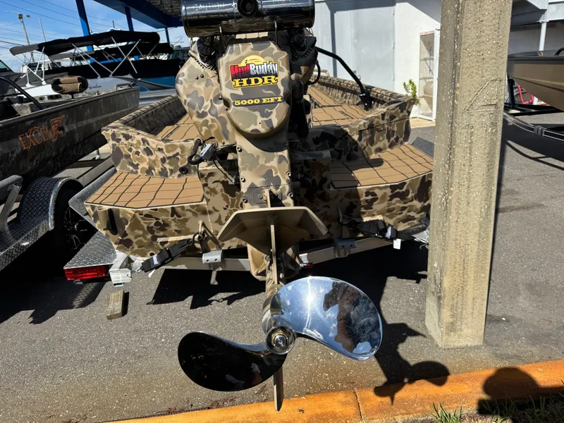 Slide: The Image of 2025 Excel 1860 F4 Shallow Water boat with camouflage design and powerful motor. - 22