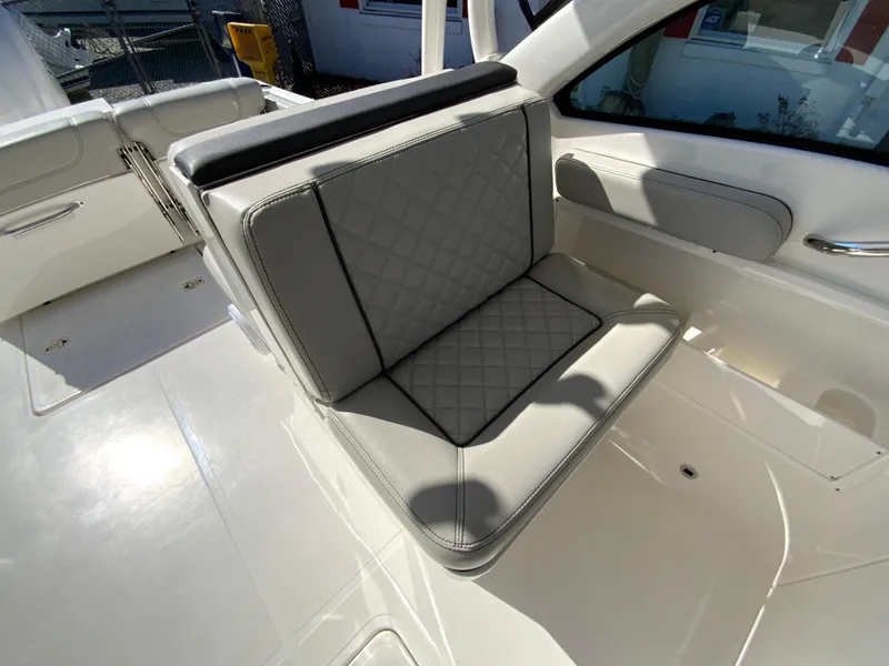 Slide: The Image of 2024 Pursuit DC 246 Dual Console boat seat with quilted upholstery. - 30