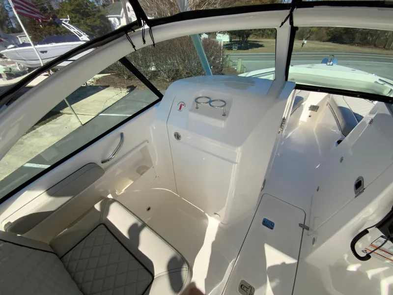 Slide: The Image of 2024 Pursuit DC 246 Dual Console interior with seating and dashboard view. - 31