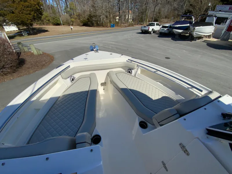 Slide: The Image of 2024 Pursuit DC 246 Dual Console boat with spacious seating and sleek design. - 40