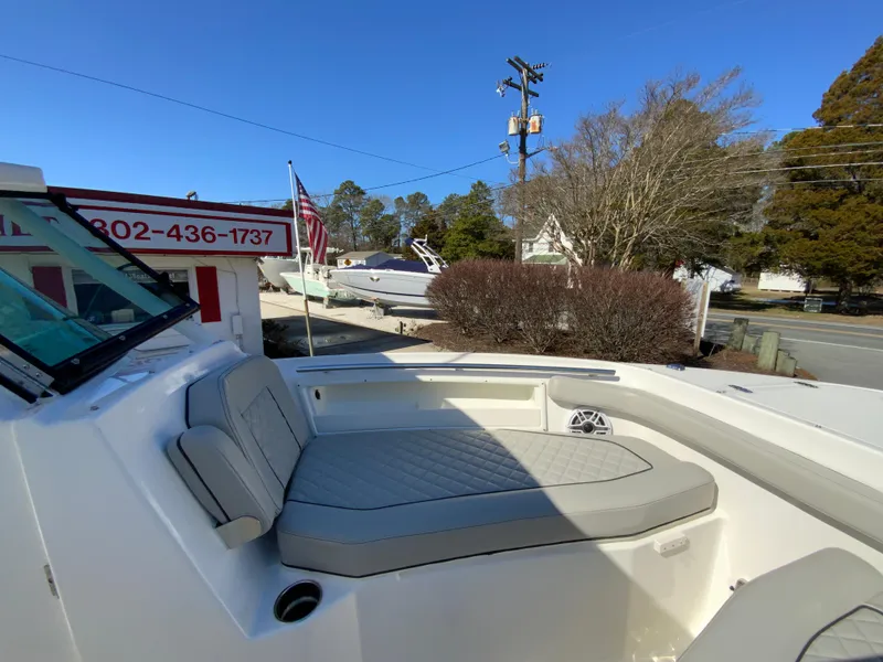 Slide: The Image of 2024 Pursuit DC 246 Dual Console boat with comfortable seating and sleek design. - 43