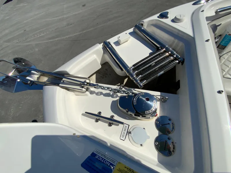 Slide: The Image of 2024 Pursuit DC 246 Dual Console boat anchor and control panel detail. - 49