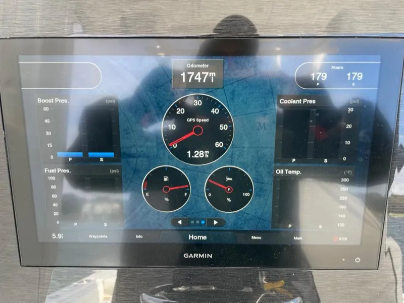 Slide: The Image of Garmin display showing boat metrics for 2021 Regulator 28, including odometer and speed. - 6