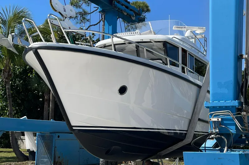 Slide: The Image of Sargo 36 Flybridge 2015 boat on lift, showcasing sleek design and sturdy construction. - 3