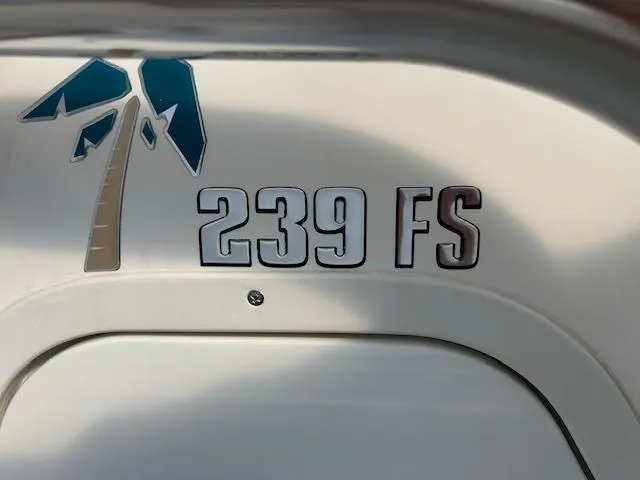 Slide: The Image of 2023 Key West 239 FS boat logo with palm tree design. - 10
