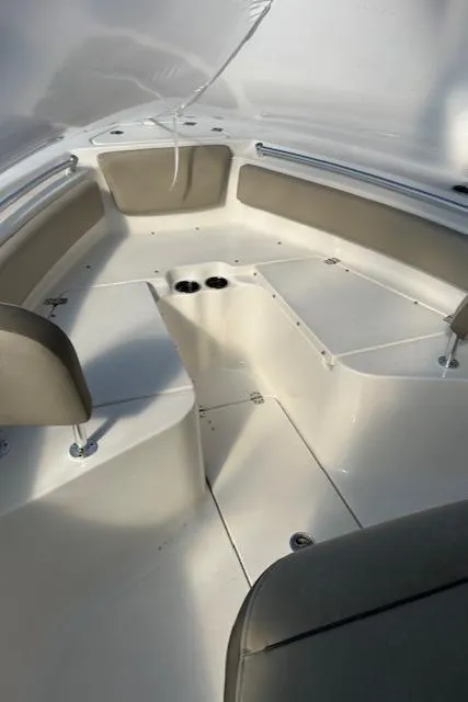 Slide: The Image of 2023 Key West 239 FS boat interior with seating and cup holders. - 4