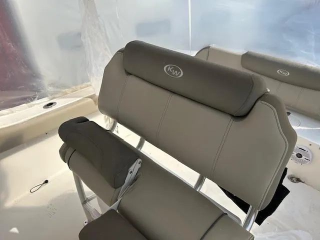Slide: The Image of 2023 Key West 239 FS boat seating with cushioned backrests and armrests. - 9