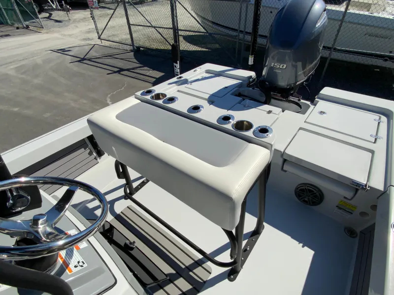 Slide: The Image of 2023 Pathfinder 2200 TRS boat interior with steering wheel and seating. - 19