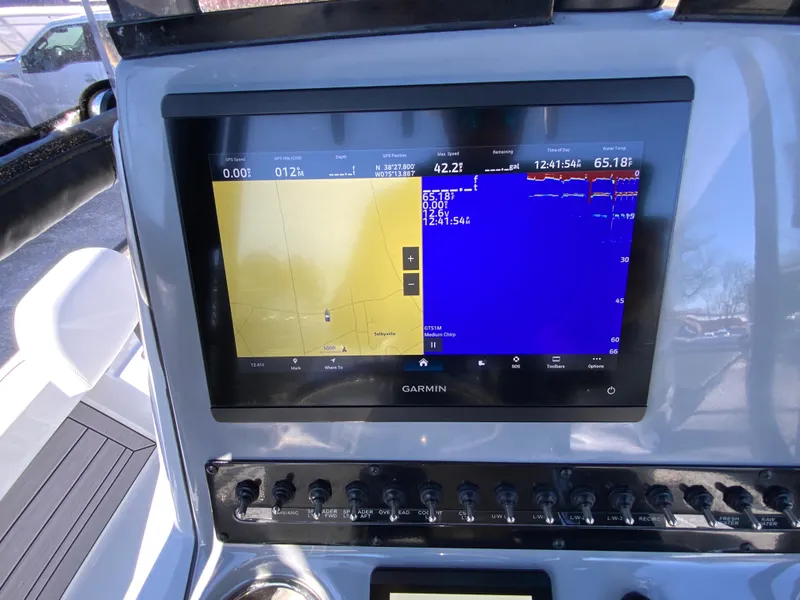 Slide: The Image of Garmin navigation display on 2023 Pathfinder 2200 TRS boat dashboard. - 23