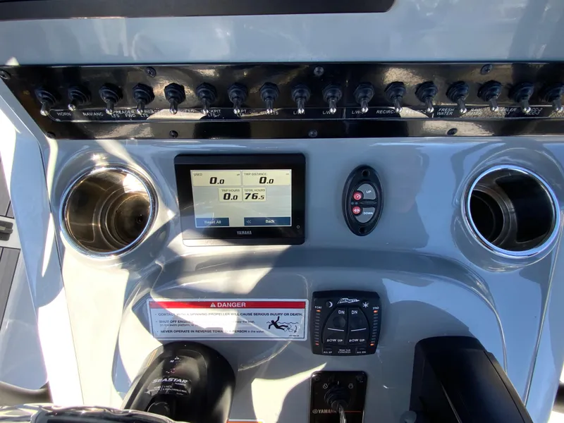 Slide: The Image of Control panel of 2023 Pathfinder 2200 TRS boat with digital display and switches. - 25