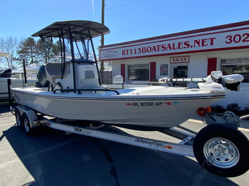 Slide: The Image of 2023 Pathfinder 2200 TRS boat on trailer at dealership, sunny day. - 3