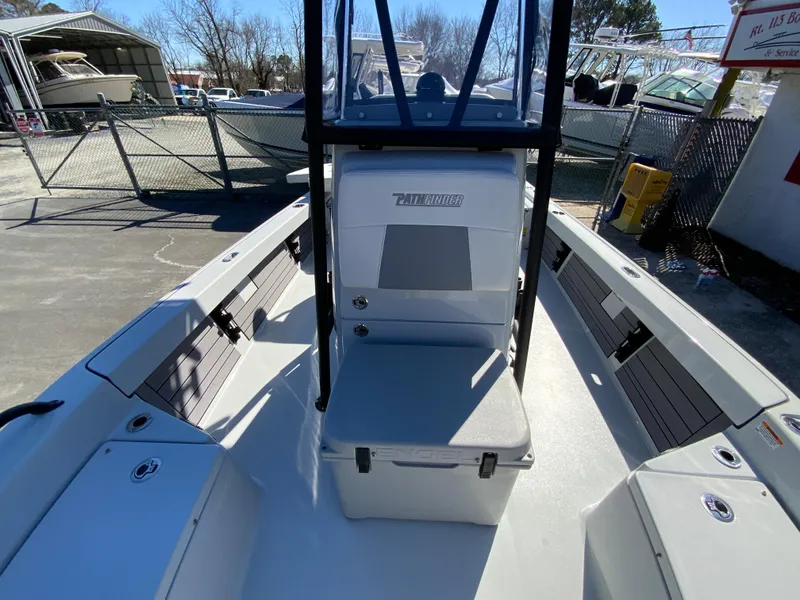 Slide: The Image of 2023 Pathfinder 2200 TRS boat interior with seating and storage compartments. - 38