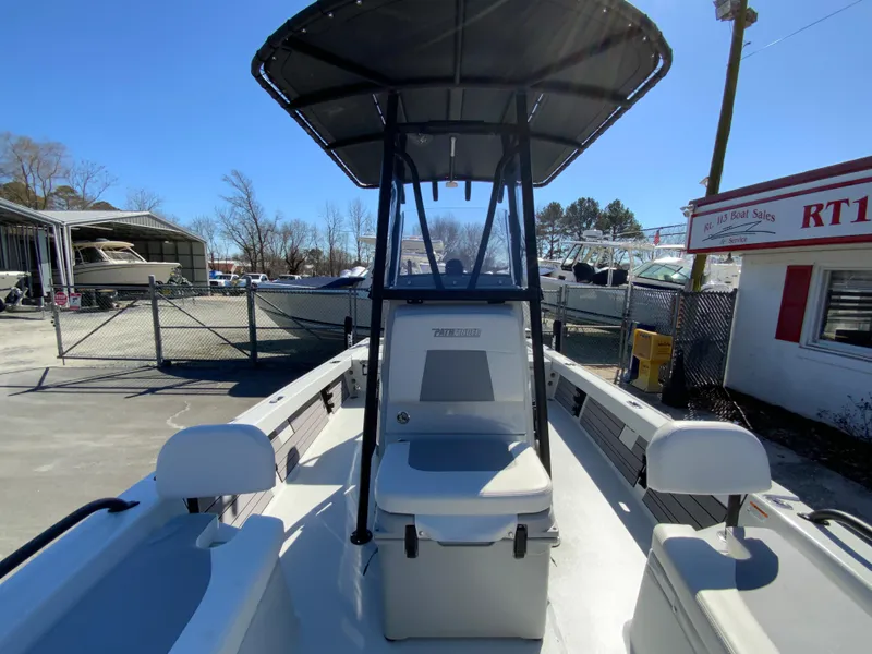 Slide: The Image of 2023 Pathfinder 2200 TRS boat with T-top, docked outdoors. - 45