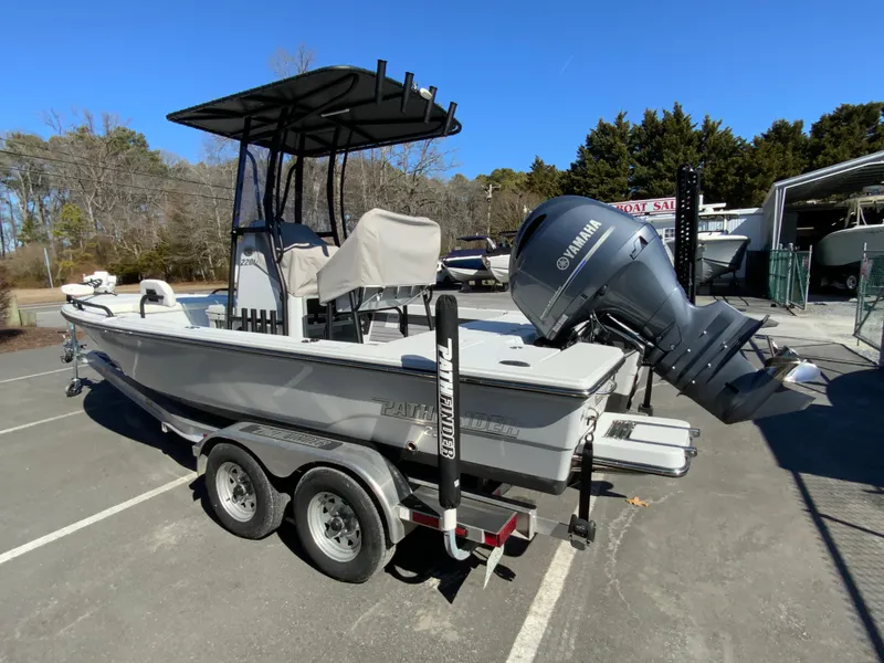 Slide: The Image of 2023 Pathfinder 2200 TRS boat with Yamaha engine on trailer, parked outdoors. - 6