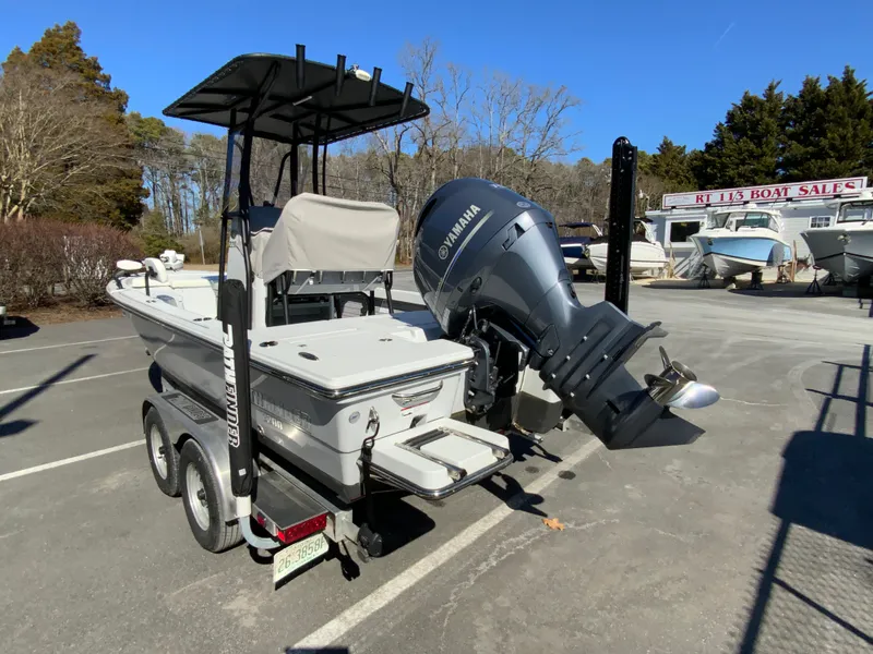 Slide: The Image of 2023 Pathfinder 2200 TRS boat with Yamaha engine on trailer in parking lot. - 7