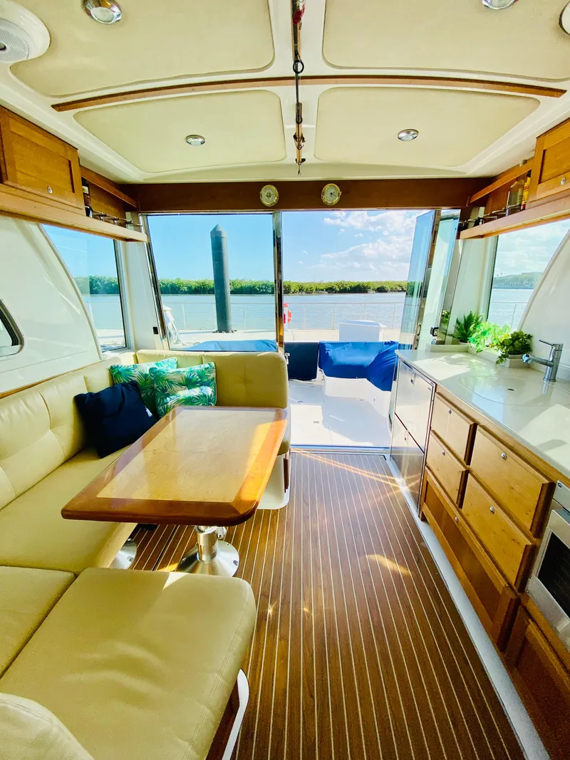 Slide: The Image of Luxurious interior of a 2014 Back Cove 41 yacht with elegant wood finishes and scenic views. - 15