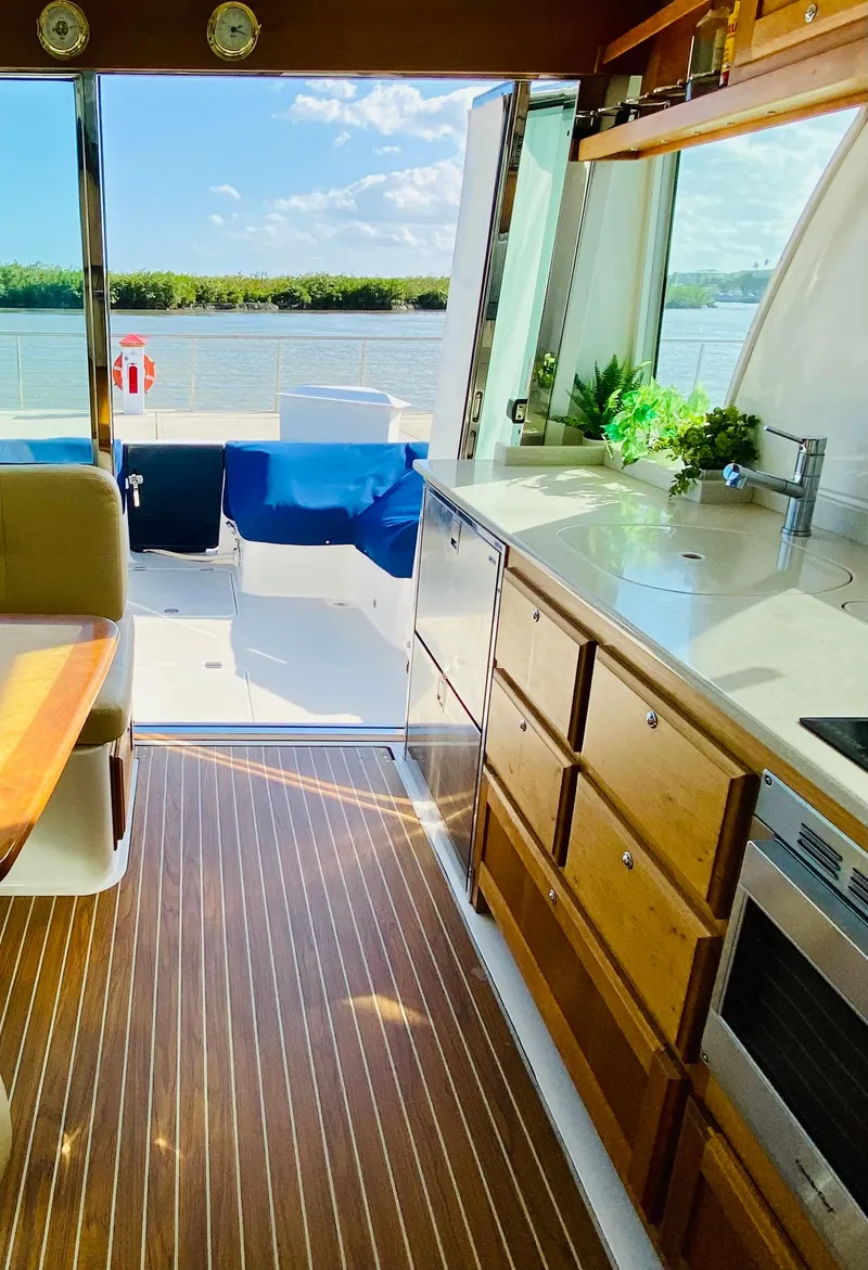 Slide: The Image of Interior of 2014 Back Cove 41 yacht with wooden flooring and modern kitchen. - 16