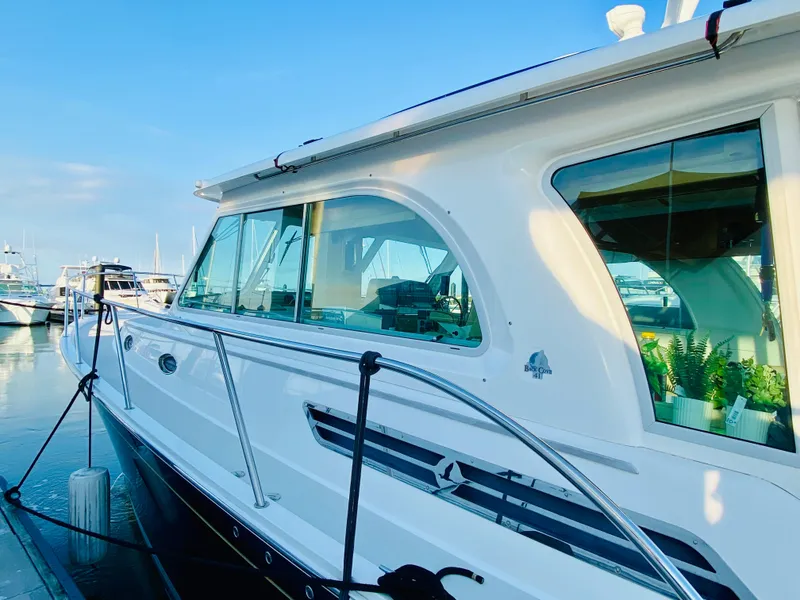 Slide: The Image of 2014 Back Cove 41 yacht docked at marina under clear blue sky. - 2