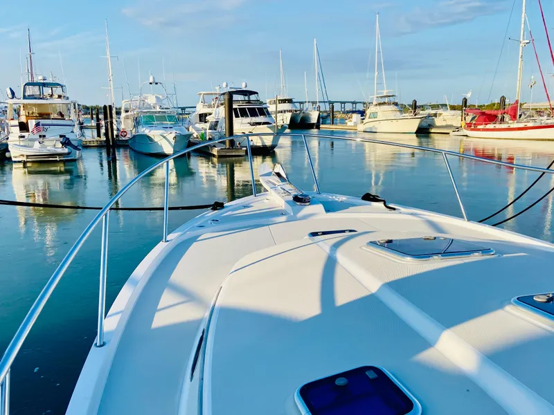 Slide: The Image of Back Cove 41 yacht, 2014 model, docked in a serene marina setting. - 3